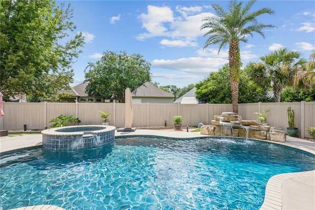 view of pool with an in ground hot tub and pool water feature