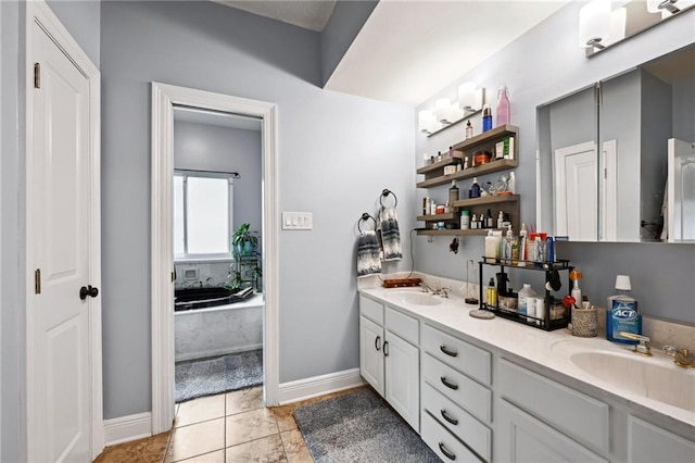 bathroom with vanity, a bathing tub, and tile patterned floors