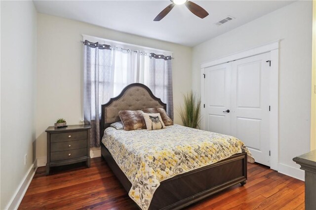 1720 Lapeyrouse St, New Orleans, LA 70116 - bedroom with dark wood-style floors, baseboards, a closet, and ceiling fan