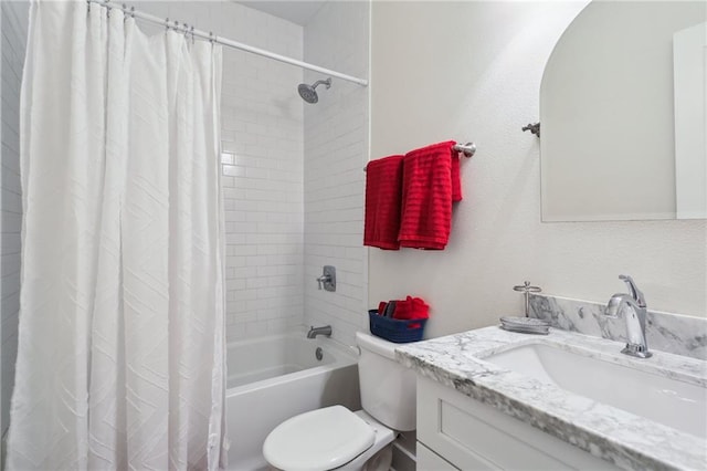 full bathroom with vanity, shower / bath combo with shower curtain, and toilet