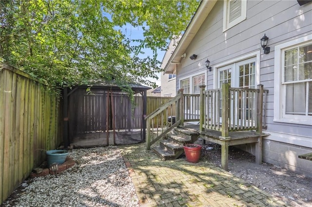 1720 Lapeyrouse St, New Orleans, LA 70116 - fenced backyard featuring french doors
