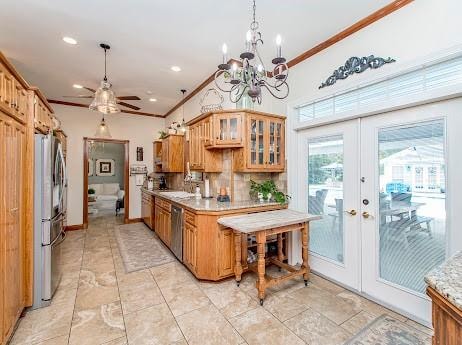 kitchen featuring light tile patterned floors, french doors, and crown molding