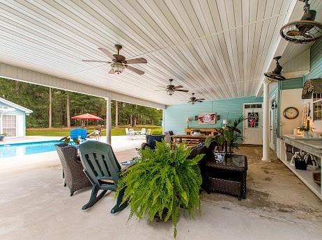 view of patio with ceiling fan