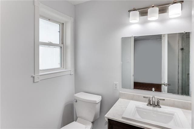 1112 Michael St, Marrero, LA 70072 - bathroom featuring vanity, a shower with shower door, and toilet