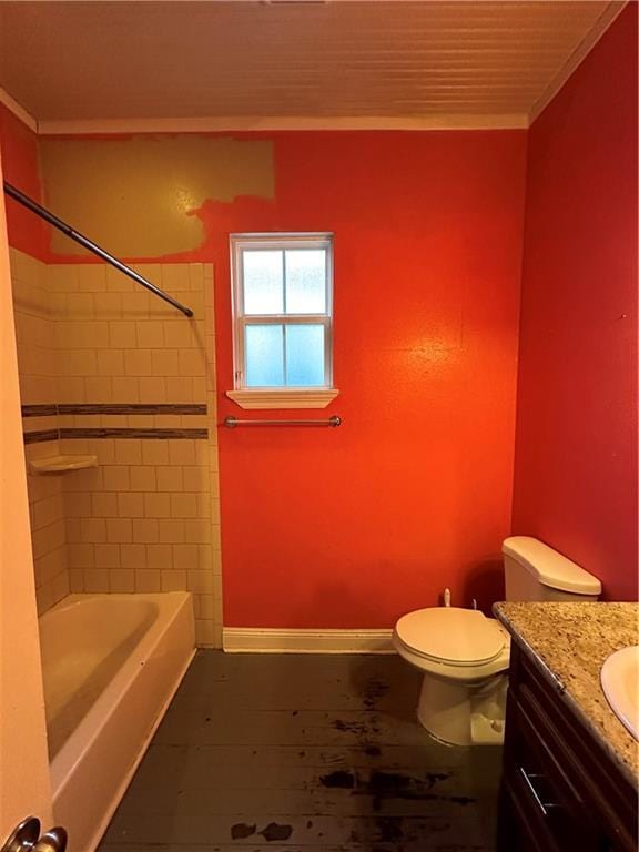 bathroom featuring crown molding, toilet, tub / shower combination, vanity, and baseboards