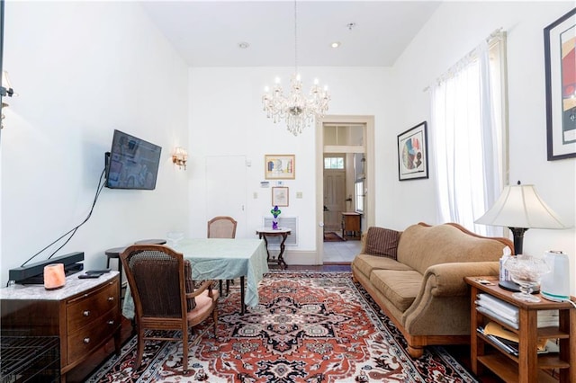 interior space with a notable chandelier, tile patterned floors, and a healthy amount of sunlight