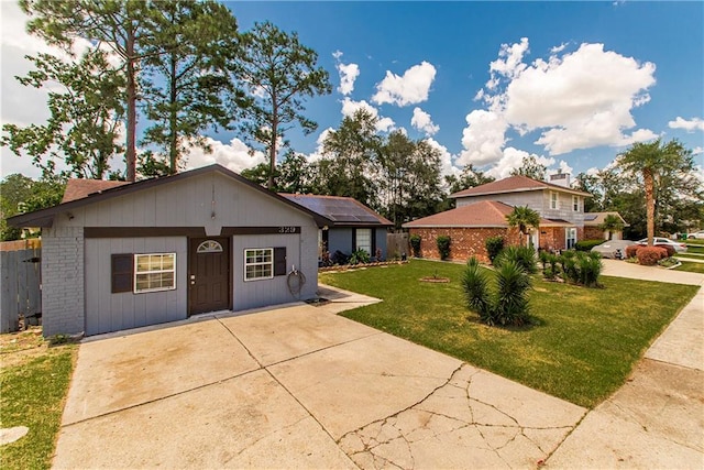 view of front of home with a front lawn