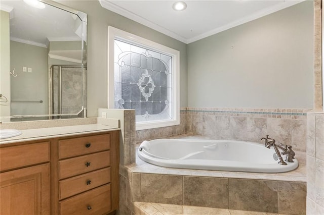 bathroom featuring vanity, ornamental molding, and independent shower and bath