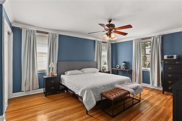 bedroom with wood-type flooring and ceiling fan