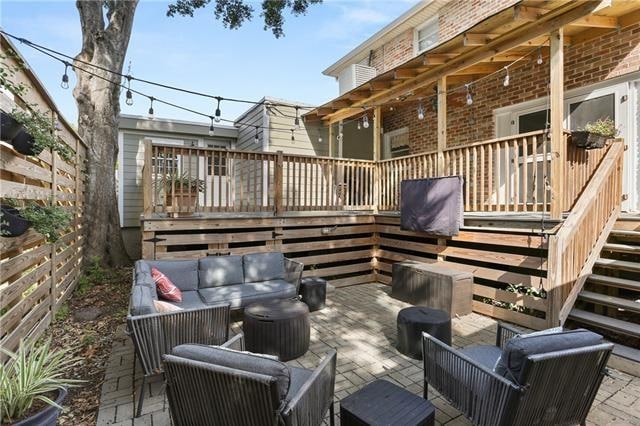 view of patio / terrace featuring a wooden deck and outdoor lounge area