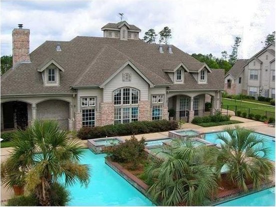 exterior space with a swimming pool with hot tub