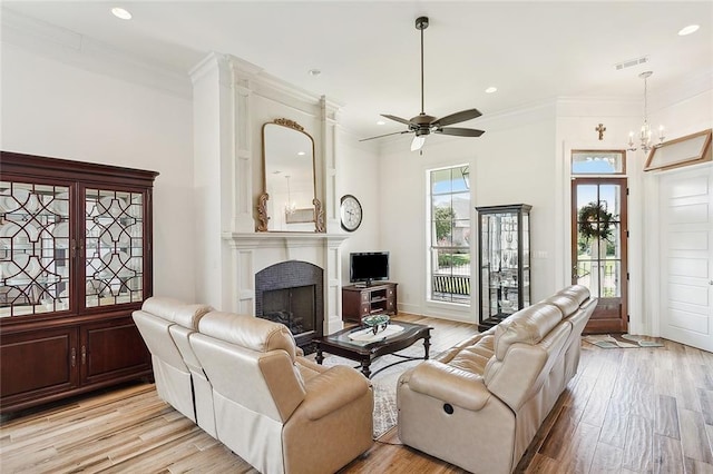 living room with light hardwood / wood-style floors and a wealth of natural light