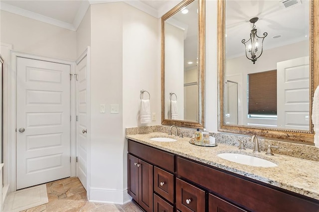 bathroom featuring crown molding, tile patterned flooring, and double sink vanity