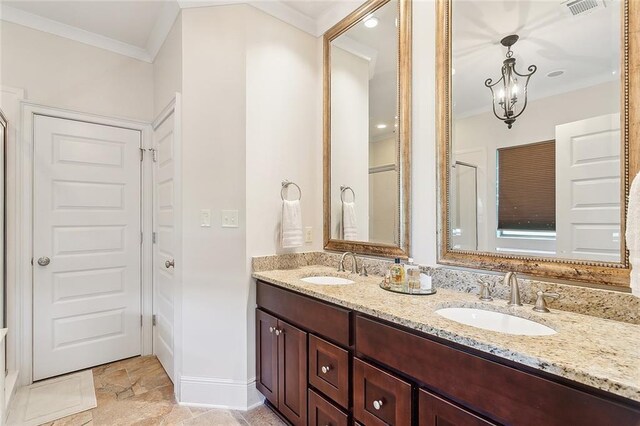 285 Cypress Lakes Dr, Slidell, LA 70458 - bathroom featuring double vanity, visible vents, a sink, and crown molding
