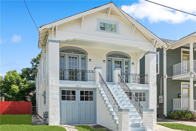 view of front of house with a garage and a porch