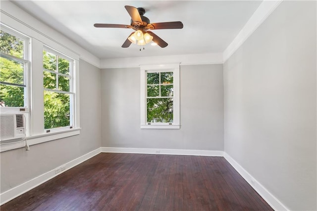 unfurnished room featuring ceiling fan, dark hardwood / wood-style floors, and a wealth of natural light