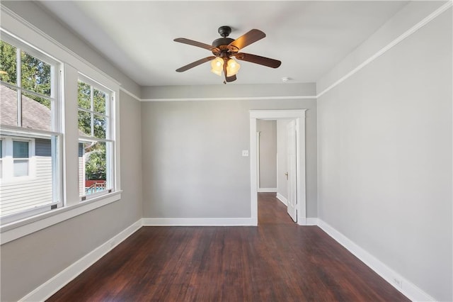 unfurnished room with dark wood-type flooring and ceiling fan