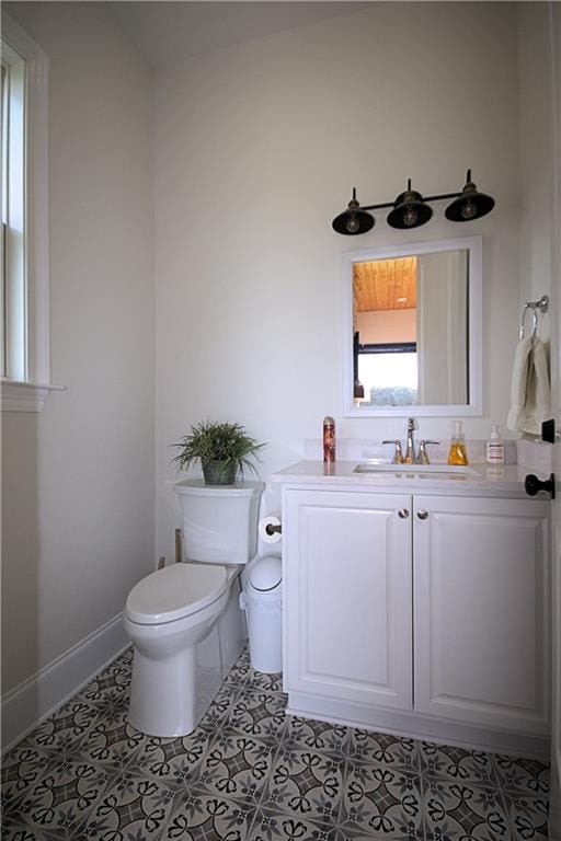 bathroom with tile patterned floors, toilet, and vanity