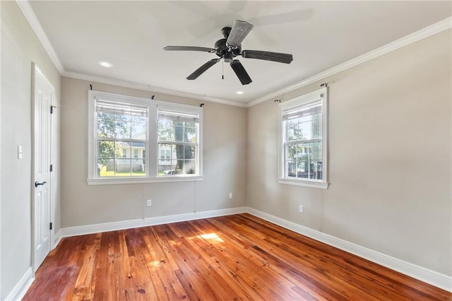 unfurnished room with crown molding, hardwood / wood-style flooring, and a wealth of natural light