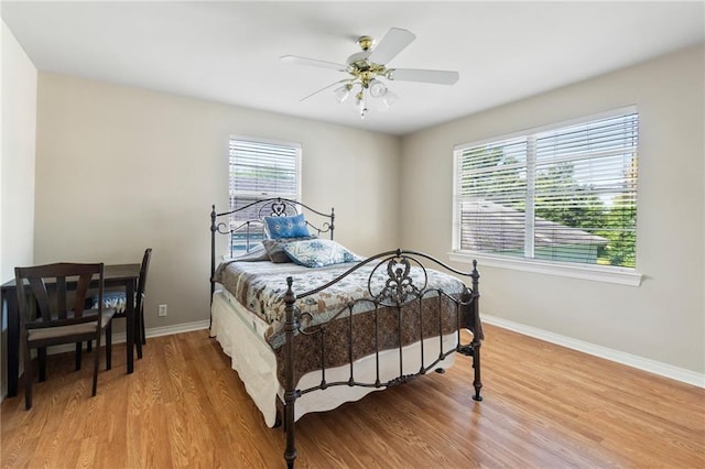 bedroom featuring hardwood / wood-style floors and ceiling fan