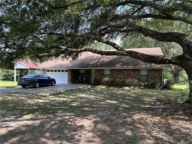 ranch-style house with a garage and a carport