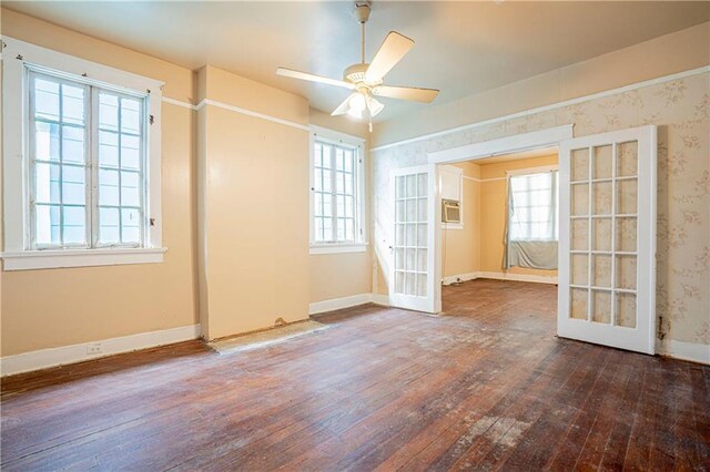 spare room with wood-type flooring, french doors, and ceiling fan