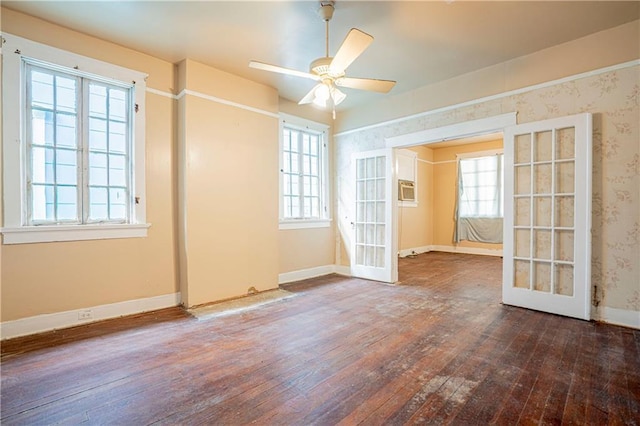 spare room featuring ceiling fan, french doors, and dark hardwood / wood-style flooring