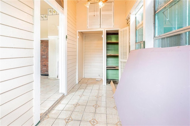 hall with light tile patterned flooring