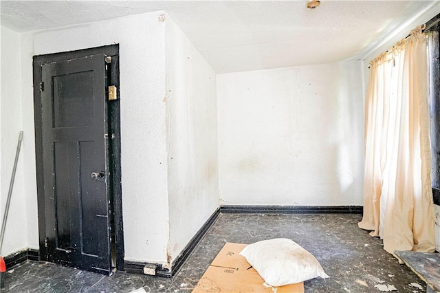 empty room with a textured ceiling