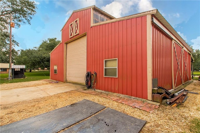 view of outbuilding featuring a garage