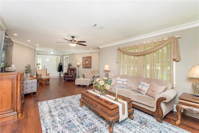 living room featuring ceiling fan, crown molding, and dark hardwood / wood-style flooring