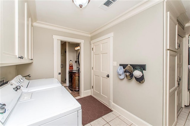 laundry room with separate washer and dryer, cabinets, light tile patterned floors, and crown molding