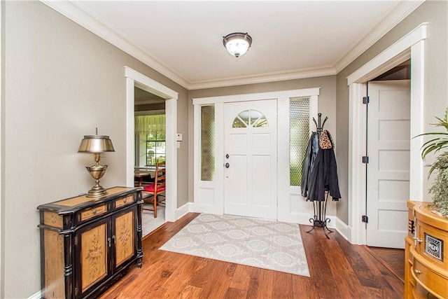 entrance foyer featuring wood-type flooring and crown molding