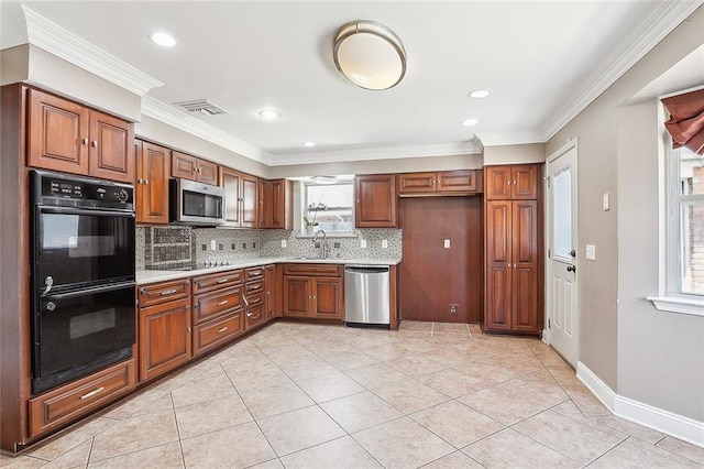 kitchen with tasteful backsplash, stainless steel appliances, and a wealth of natural light