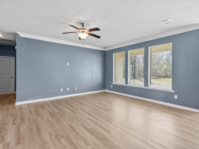 unfurnished room featuring ceiling fan, ornamental molding, and light hardwood / wood-style floors