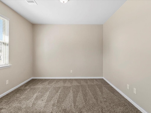 unfurnished room with plenty of natural light and carpet floors