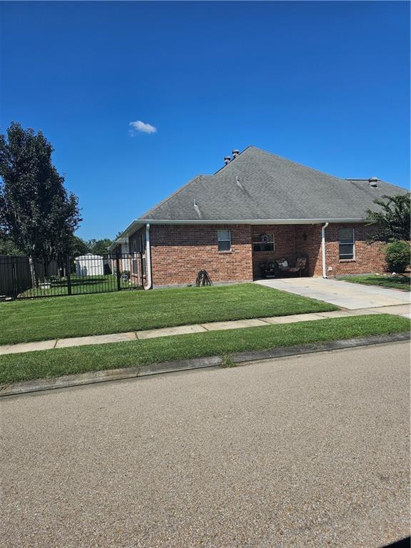 669 Lake Iberville Ct, Ponchatoula, LA 70454 - view of property exterior with brick siding and driveway