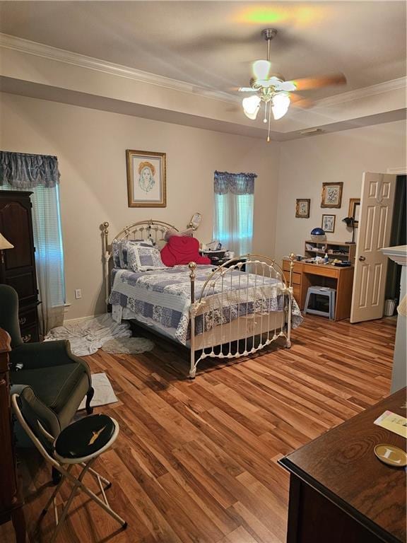 669 Lake Iberville Ct, Ponchatoula, LA 70454 - bedroom featuring ornamental molding, wood finished floors, and ceiling fan