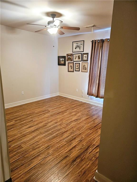 669 Lake Iberville Ct, Ponchatoula, LA 70454 - unfurnished room featuring ceiling fan, wood finished floors, and baseboards