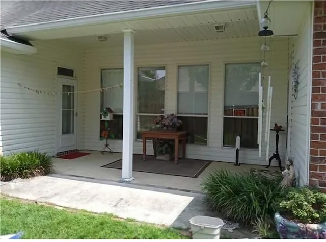 669 Lake Iberville Ct, Ponchatoula, LA 70454 - doorway to property with roof with shingles and covered porch
