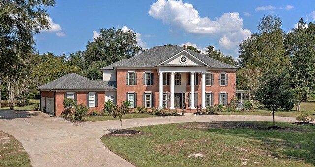 neoclassical / greek revival house with a front yard