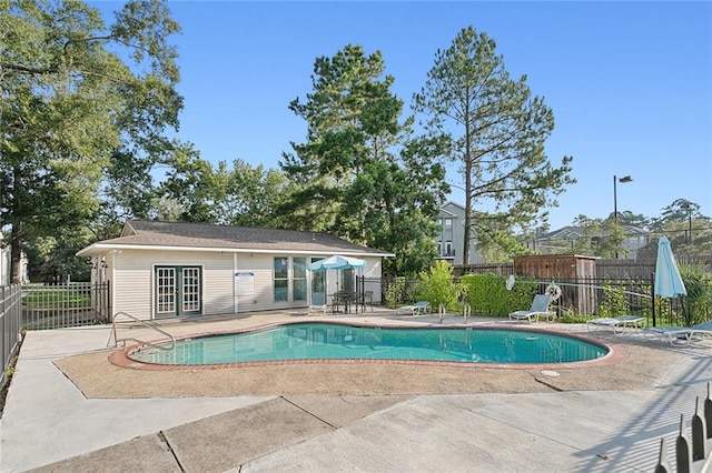 view of swimming pool featuring a patio area