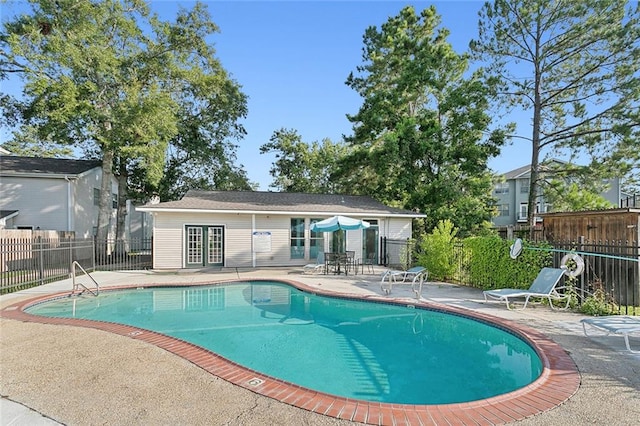 view of swimming pool with a patio