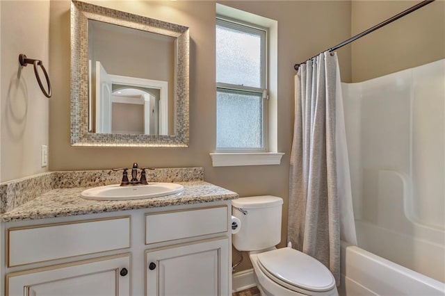 full bathroom with shower / tub combo, vanity, and toilet