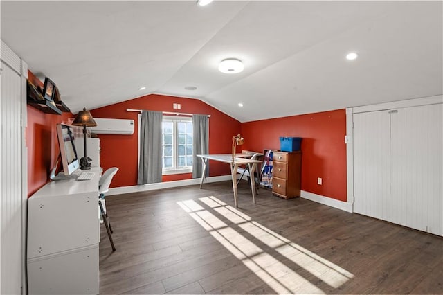 unfurnished bedroom featuring a wall unit AC, dark hardwood / wood-style floors, and lofted ceiling