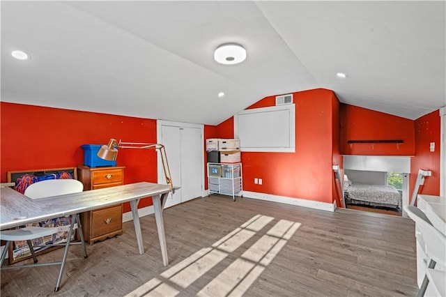 bedroom featuring vaulted ceiling and light hardwood / wood-style floors