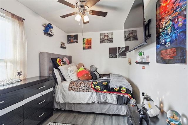 bedroom featuring ceiling fan and hardwood / wood-style flooring