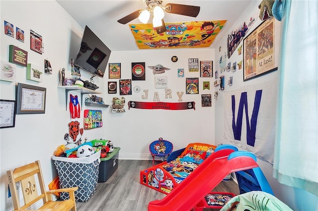 bedroom featuring ceiling fan and hardwood / wood-style flooring