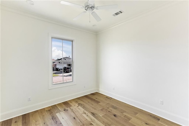 unfurnished room featuring ornamental molding, a healthy amount of sunlight, ceiling fan, and light hardwood / wood-style floors