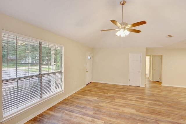 empty room featuring ceiling fan and light wood-type flooring